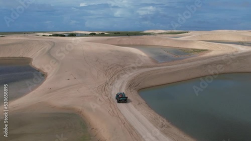 4x4 cars through the dunes of Jericoacoara in Brazil photo