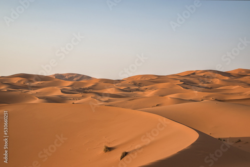 Dunes in the Sahara desert at sunset, the desert near the town of Merzouga, a beautiful African landscape