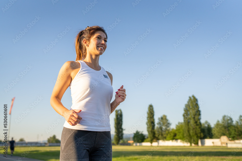 one woman run on stadium running track training one woman run on stadium running track training