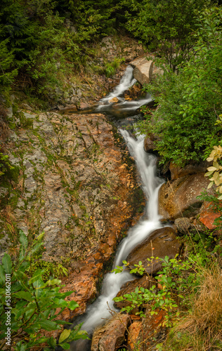 Svatopetrsky waterfall near Spindleruv Mlyn town in Krkonose mountains photo