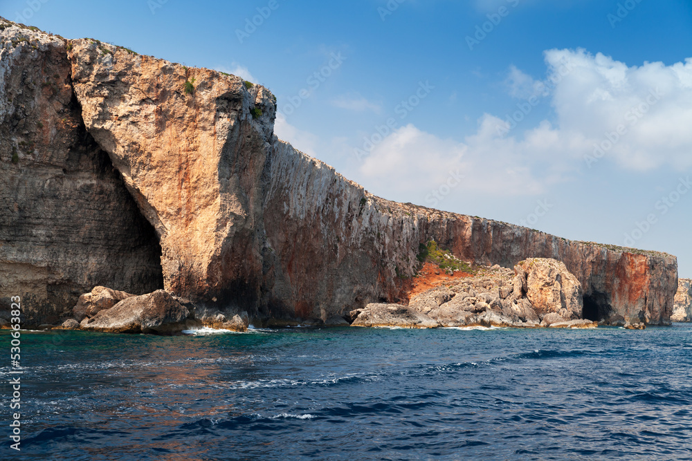 Natural stone arch. Coastal landscape of Comino, Malta