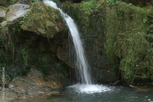 a small waterfall on a mountain river