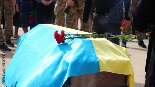 Ukraine. War. The funeral of Ukrainian soldiers who died during the Russian invasion of Ukraine. Coffin decorated with flowers. The funeral ceremony of a soldier. Funeral ceremony.