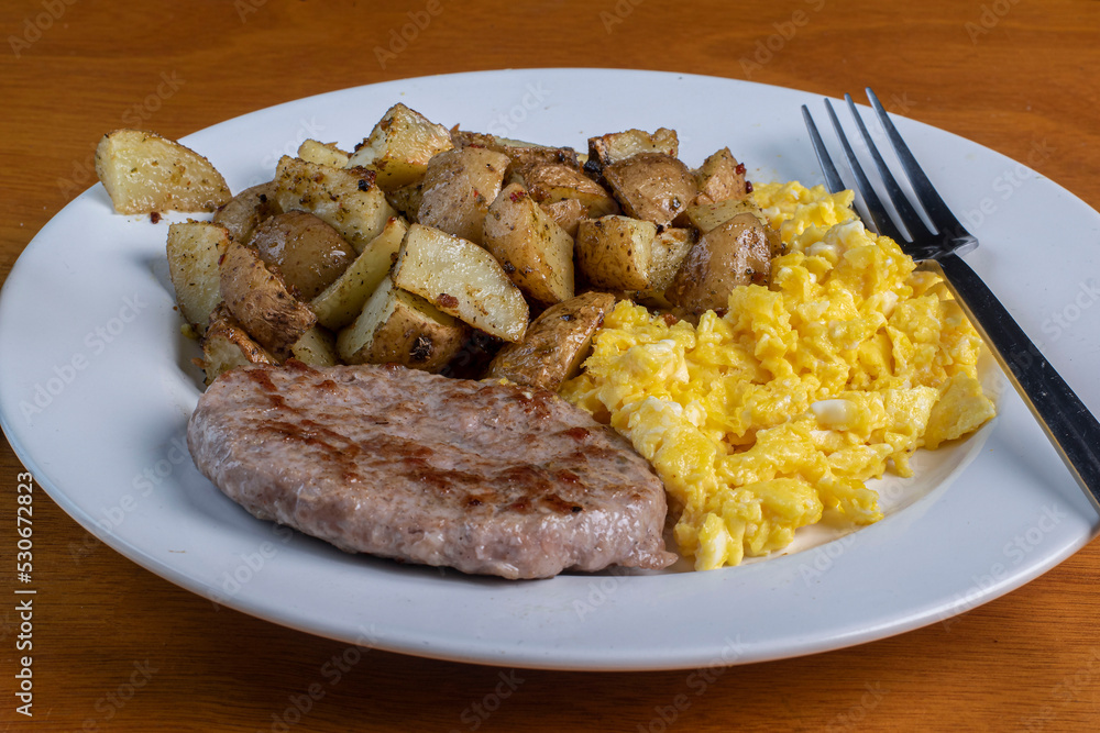 scramble eggs with home fries and sausage patty scramble eggs with home fries and sausage patty