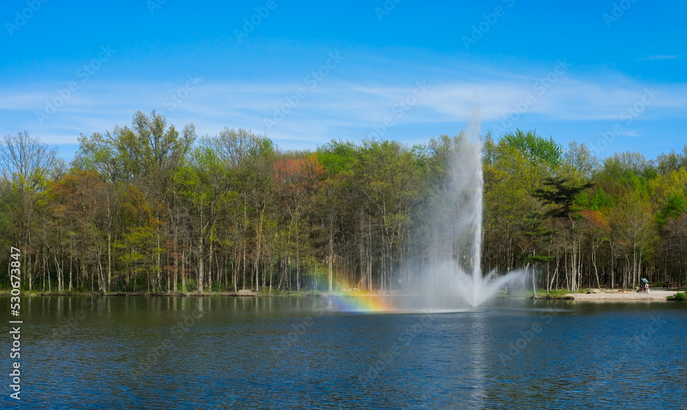 Lake fountain with rainbow from the spray