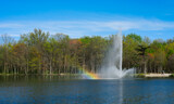 Lake fountain with rainbow from the spray