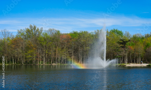 Fototapeta Naklejka Na Ścianę i Meble -  Lake fountain with rainbow from the spray