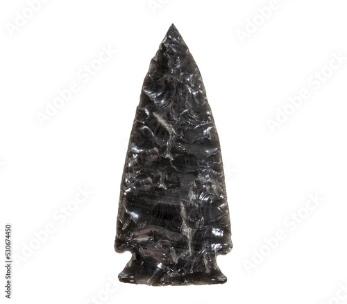 VIntage stone obsidian arrowhead isolated. photo