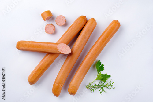 Принти на полотні Traditional raw German Frankfurter sausage offered as top view on white backgrou