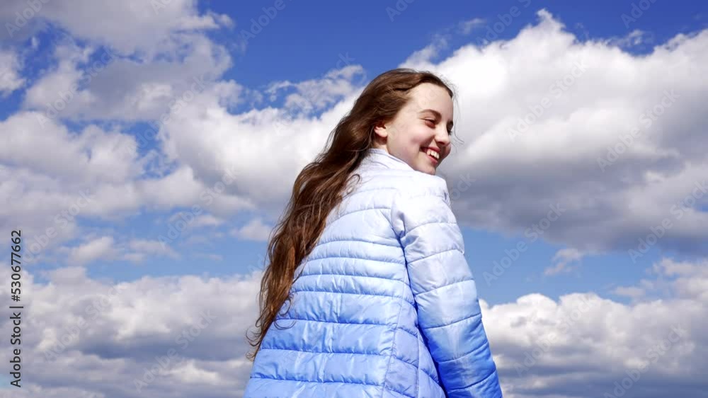 happy child in autumn jacket enjoy the sun has long hair on sky background, hair style happy child in autumn jacket enjoy the sun has long hair on sky background, hair style