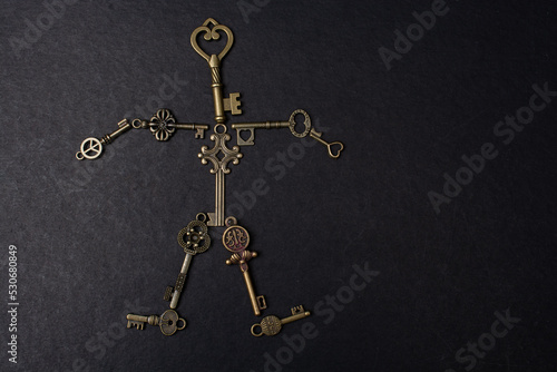 Retro metal keys form a man shape