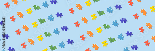 Many pieces of jigsaw puzzle on blue background. Pattern for design
