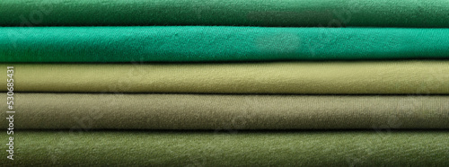 Folded color fabrics as background, closeup