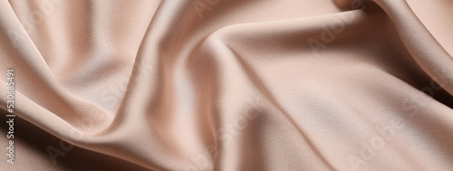 Texture of beige fabric as background, closeup