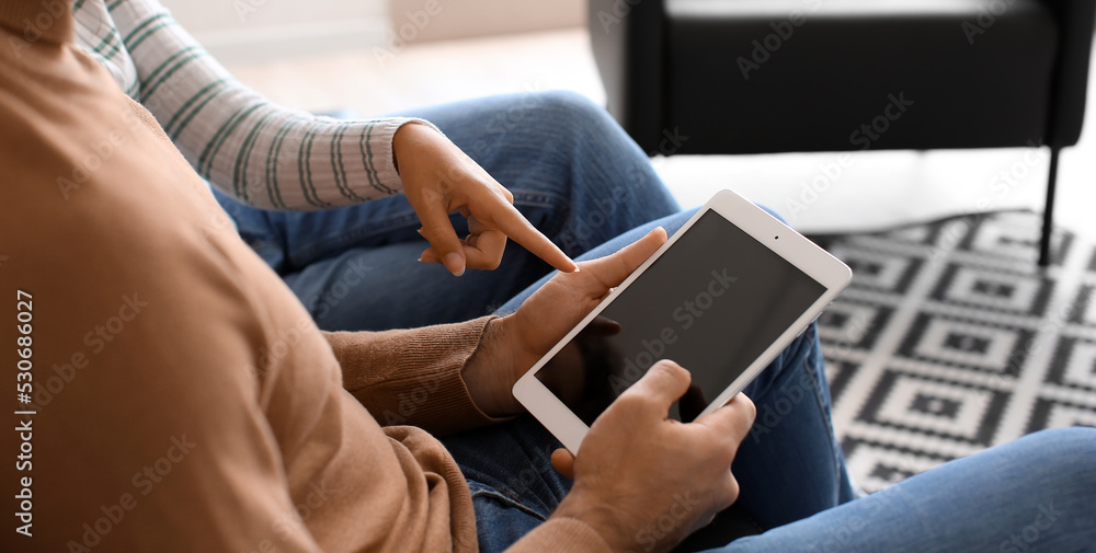 Couple with tablet computer at home Couple with tablet computer at home