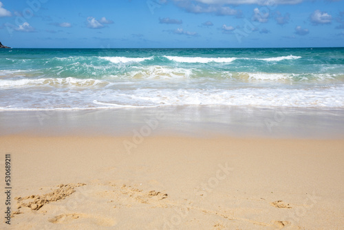 The Turquoise colored sand blue sky on sunny day and space on the sky and cloud