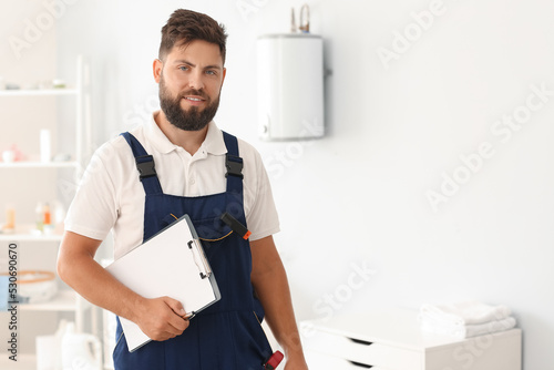 Male plumber with clipboard...