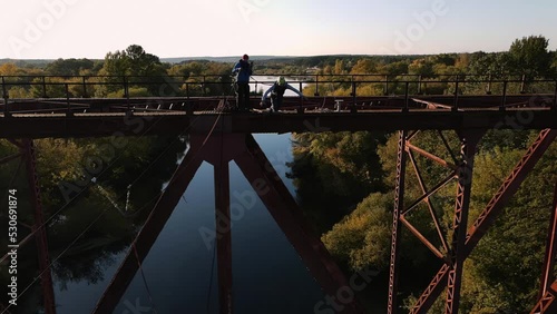 a guy jumps from a tower, a man falls from a height, rope jumping photo