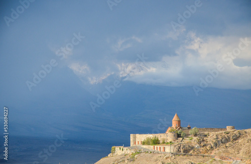 Beautiful view on Khor Virap Monastery and Mount Ararat covered with clouds in background. Armenia