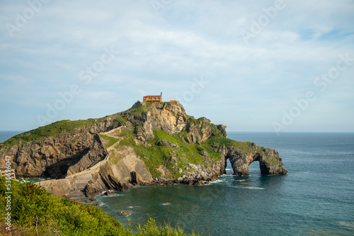 Stone footpath to famous landmark and film location in North of Spain  ocean islet with chapel San juan de gaztelugatxe  Basque Country  Spain
