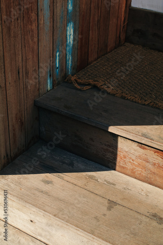 Sunlight on staircase wooden background texture on surface. Empty pathway of stairway.