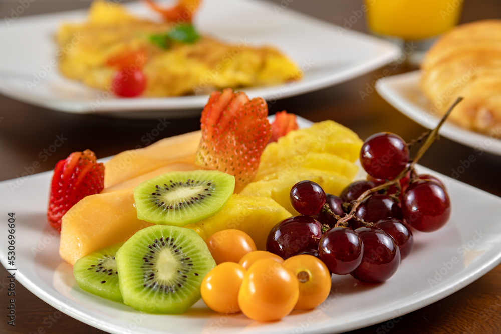 Typical colombian food, breakfast with egg, fruit and bread Typical colombian food, breakfast with egg, fruit and bread