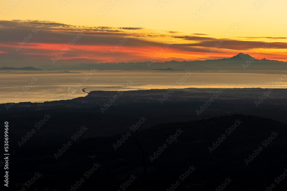 dramatic sunrise overlooking San Juan strait and the mountains beyond as viewed from Hurricane Ridge in Olympic national park.