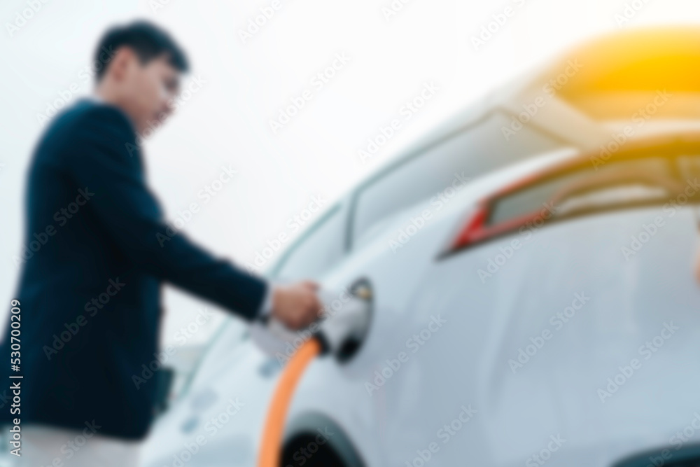 Blur electric Car at the charging station 