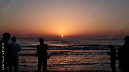 couple on the beach at sunset