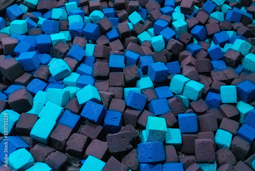 Colored foam rubber cubes background.