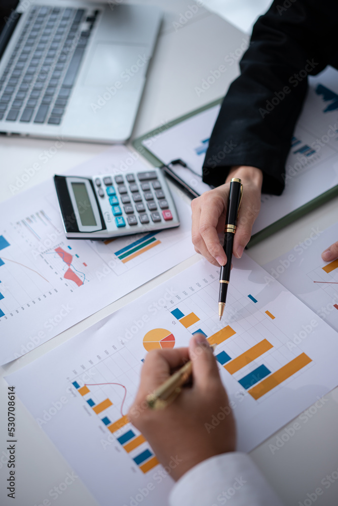 Team person analyzing financial figures Team person analyzing financial figures