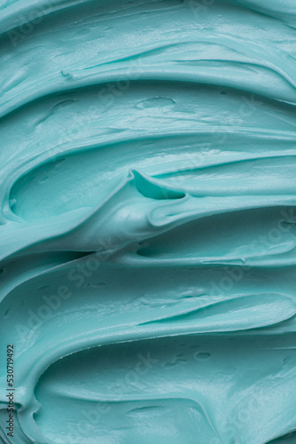 Aqua blue icing frosting close up texture