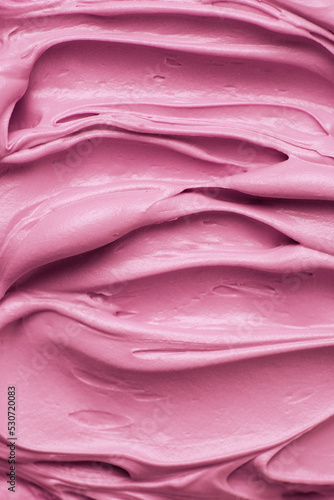 Bright pink icing frosting close up texture