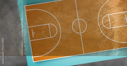 Composition of brown and blue basketball court overhead view over textured concrete wall background