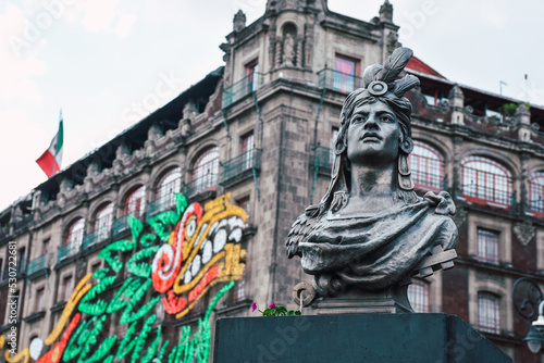 Cuauhtemoc statue in Zocalo in historic center of Mexico City, CDMX, Mexico. Cuauhtemoc is the last Aztec Emperor and ruler of Tenochtitlan from 1520 to 1521. photo