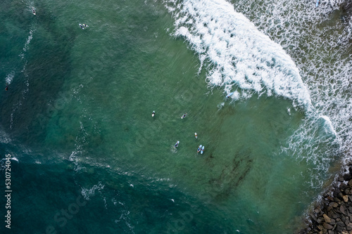 Surfers in the Atlantic Ocean off the coast of Gran Canaria, photo from a drone