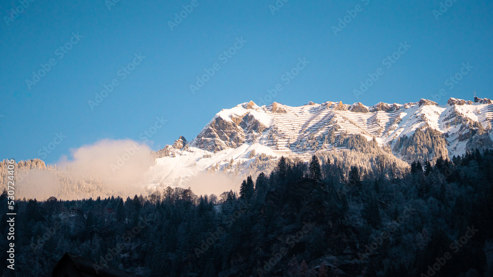 Fototapeta premium Beautiful mountains and nature in Lauterbrunnen , villages , town and valleys of Alps during autumn, winter : Lauterbrunnen , Switzerland : December 3 , 2019