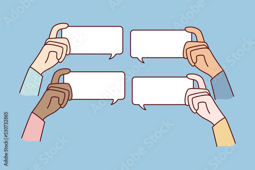 Diverse people hands holding mockup message bubbles with comments online. Users comment on internet. Talk balloons with empty copy space. Feedback and notification. 