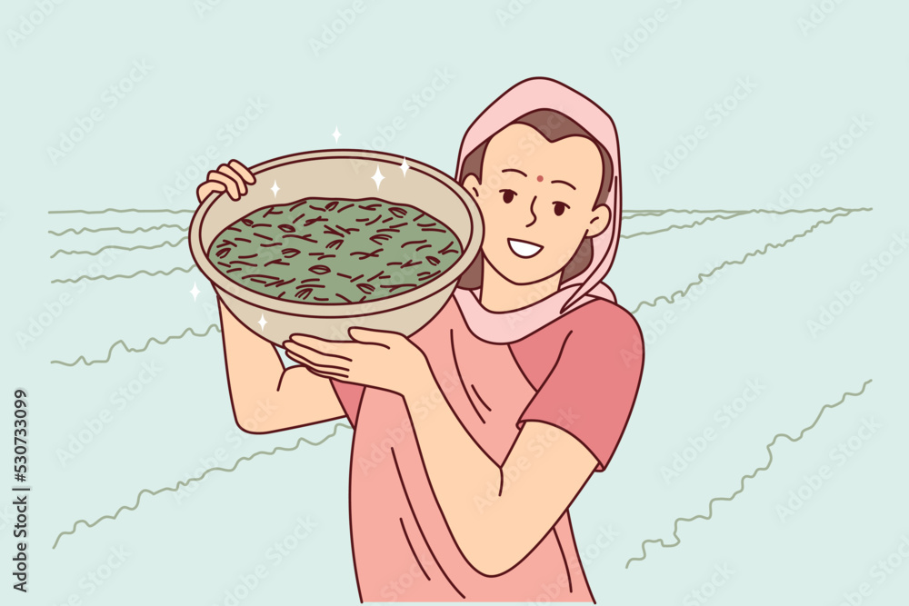 Fototapeta premium Smiling indian woman in traditional clothes show bowl working in field in countryside. Happy female worker collecting crop in rural grassland. Farming concept. Vector illustration. 