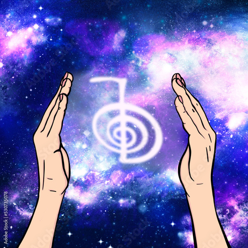 Reiki symbol. A sacred sign CHO KU REI. A hand holds Reiki CHO KU REI sign on a cosmic background. Alternative medicine. photo