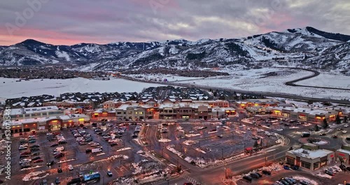 Park City Utah Aerial v27 panoramic view flyover snyderville kimball junction capturing busy town traffic surrounded by beautiful mountainscape at sunset dusk - Shot with Mavic 3 Cine - February 2022 photo