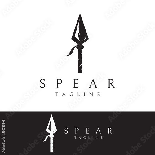 Traditional spear head and spear head logo template design for hunting. photo