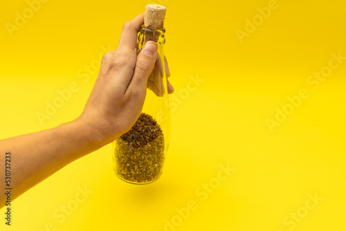 Useful buckwheat tea in a glass bottle photo