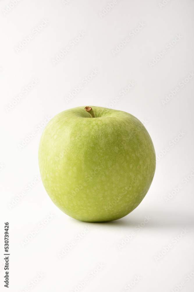 Detail of green apple on white background Detail of green apple on white background
