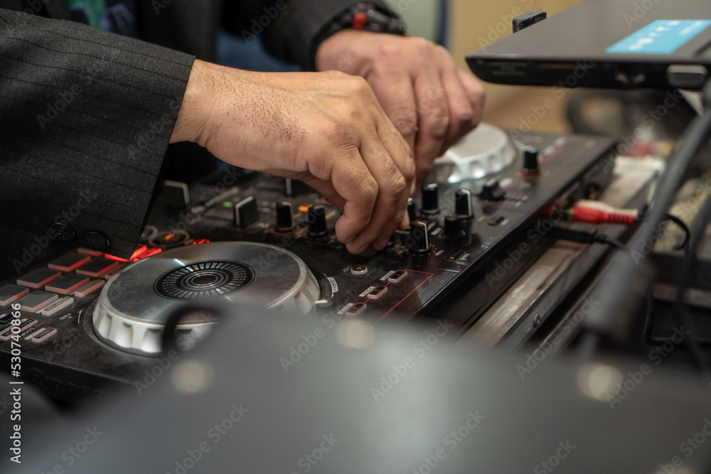 Obraz premium dj with sound console close-up
