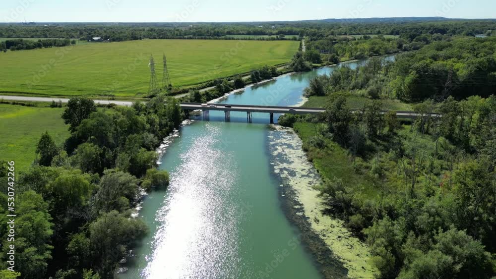 Establishing shot of inspiring vibrant countryside landscape, bridge over water Establishing shot of inspiring vibrant countryside landscape, bridge over water