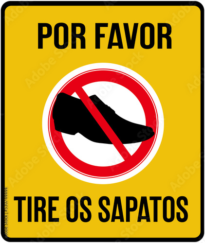 A sign that says in portuguese language : please take off your shoes.