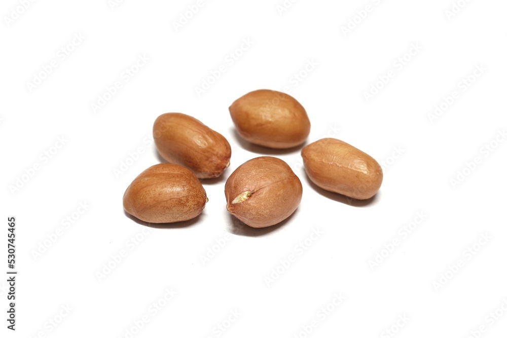 five peanuts on a white background five peanuts on a white background