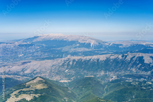 Pettorano sul Gizio village and Rotella peak slopes, aerial, Italy