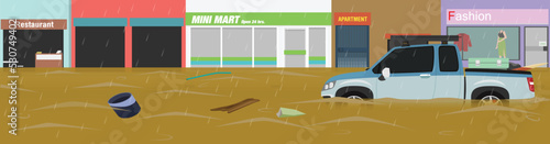 Pickup trucks wading through flooded urban areas. Garbage floating in the stream. Water that flows inundated the urban areas and trading areas.